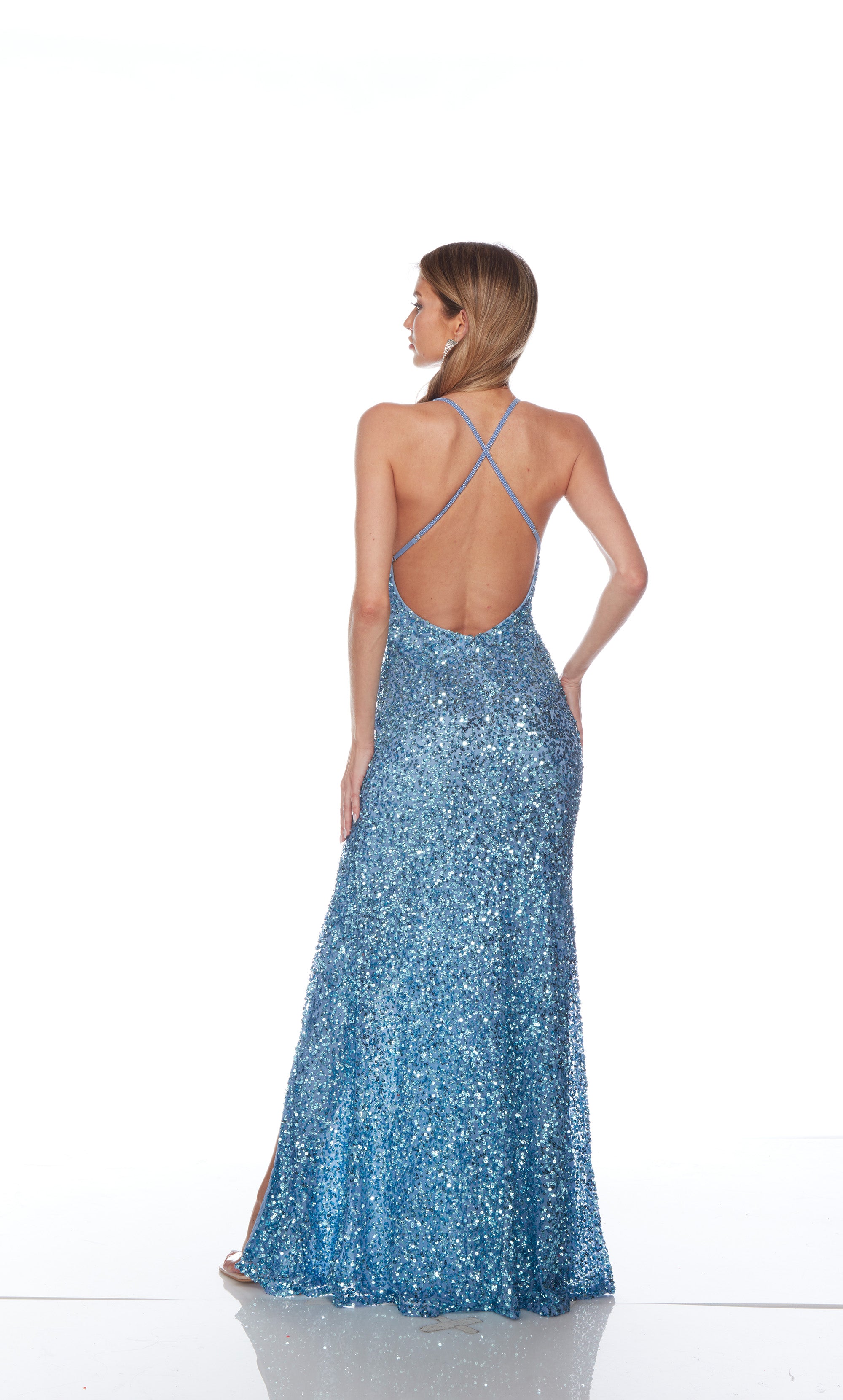 Blue sequin gown with an V neckline, slit, and crisscross adjustable strap back for an elegant and alluring look.