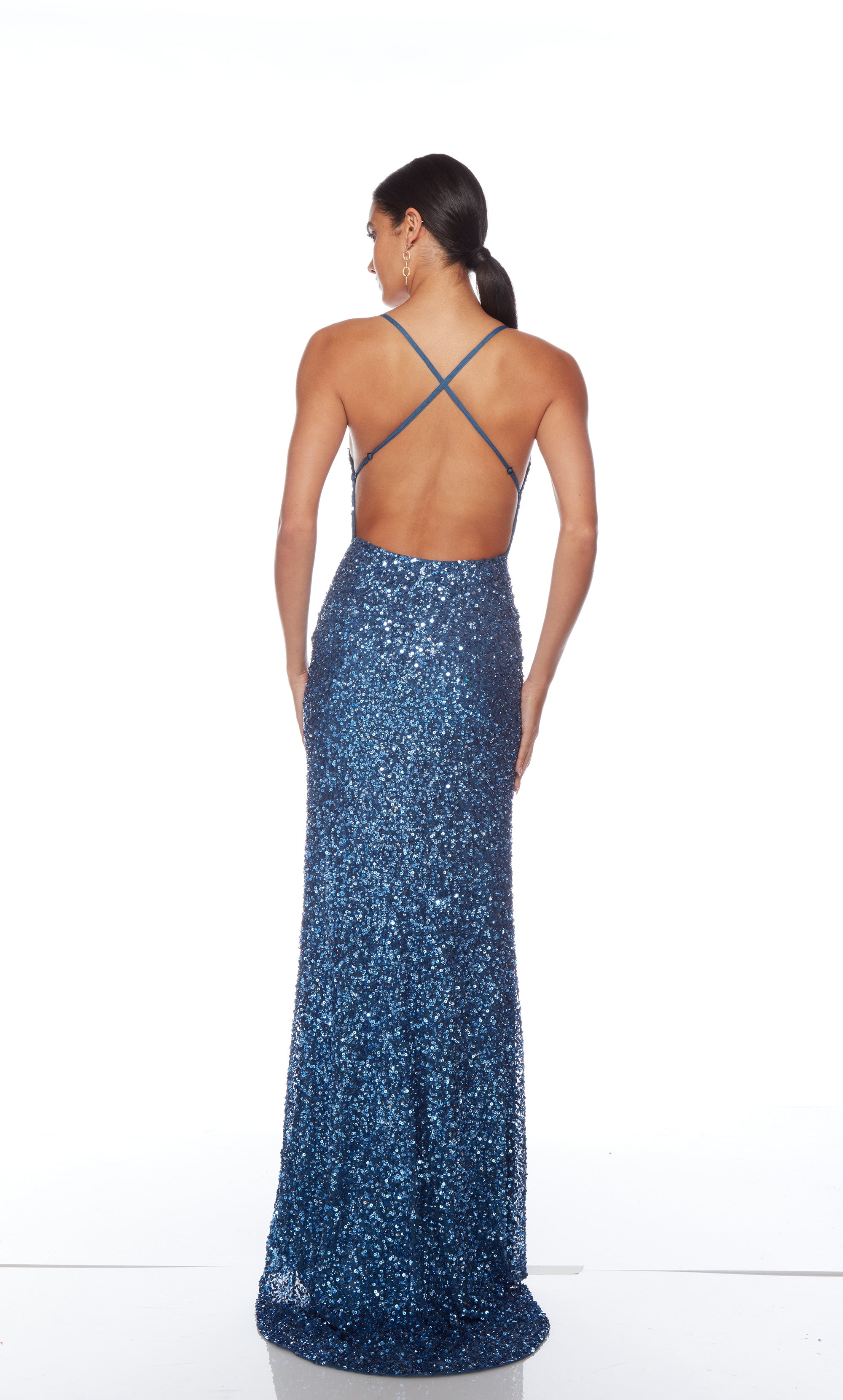 Blue sequin gown with an V neckline, slit, and crisscross adjustable strap back, and an slight train for an elegant and alluring look.