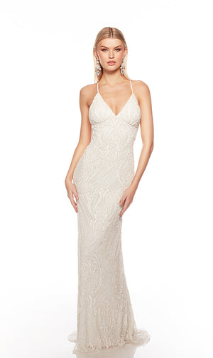 Elegant ivory formal gown: Hand-beaded, V neckline, spaghetti straps, strappy back, and intricate paisley-patterned design for an chic and sophisticated look.