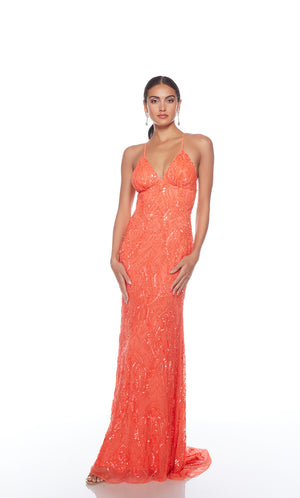 Elegant orange formal gown: Hand-beaded, V neckline, spaghetti straps, strappy back, and intricate paisley-patterned design for an chic and sophisticated look.