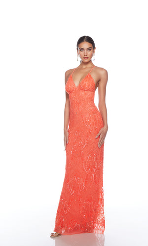 Elegant orange formal gown: Hand-beaded, V neckline, spaghetti straps, strappy back, and intricate paisley-patterned design for an chic and sophisticated look.