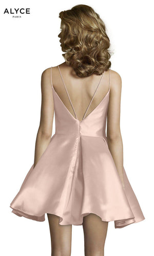 Short french pink party dress with a strappy back, pockets, and a mikado fabrication.